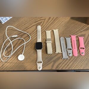 Apple Watch plus charger and 4 bands